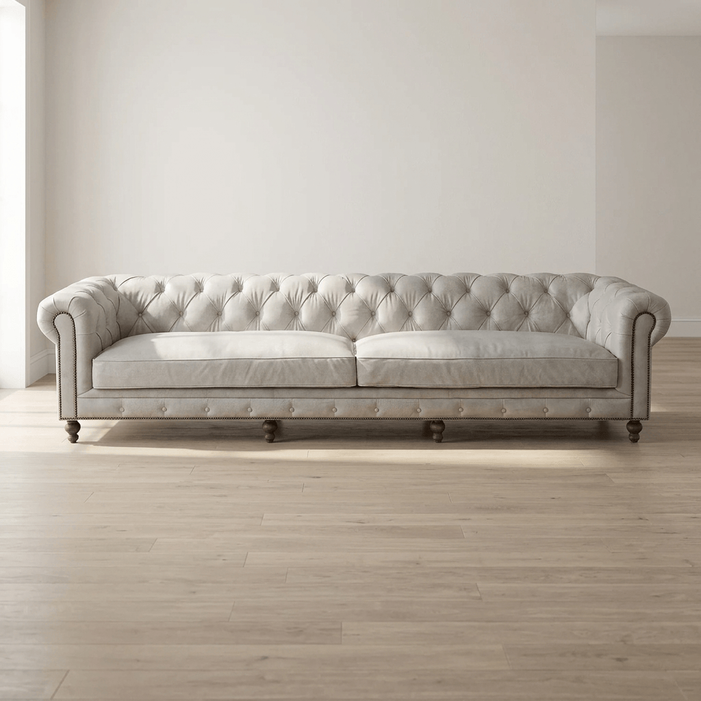 Ofer Vintage Top-Grain Leather Sofa – 122” Antique White Tufted Sofa with Nailhead Trim in a spacious living room.