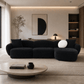 Lucifer Black & White Sectional Sofa – 127” Shimmer Fabric L-Shape Couch with 3 Pillows in modern living room setting.