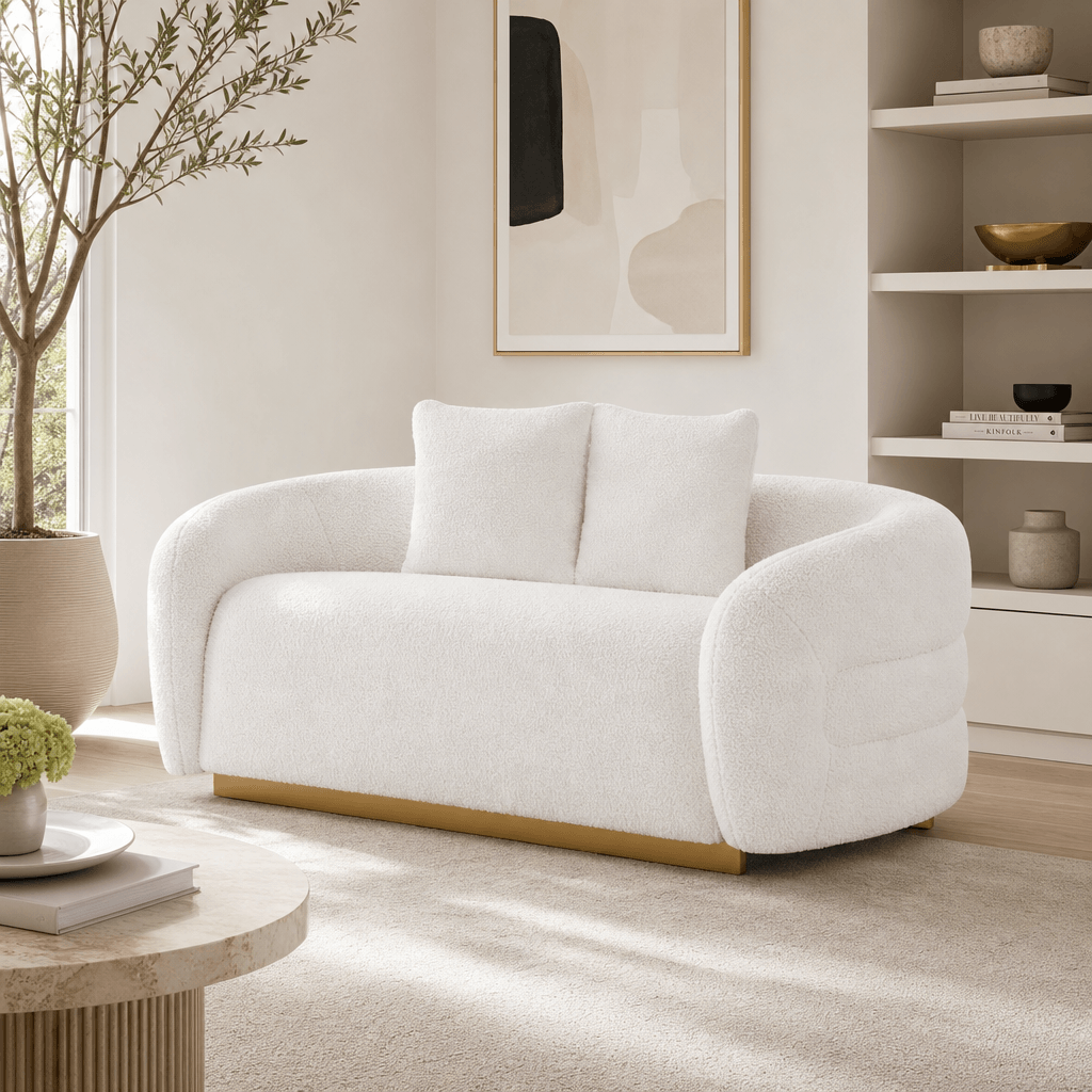 Novella Sherpa Loveseat – 71” White Fabric 2-Seater Sofa with Gold Base in a stylish living room setting.