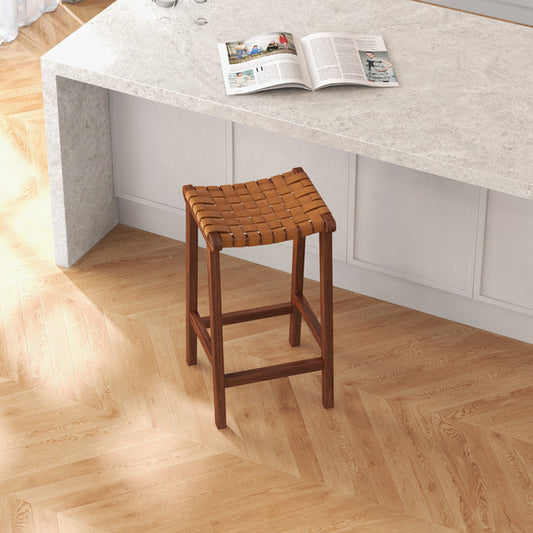 James Genuine Leather Bar & Counter Stool – Mid-Century Strapped Leather Seat at a kitchen island.