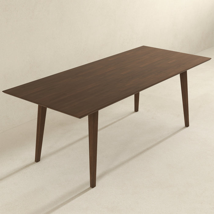 Levi MCM Walnut Dining Table – Rectangular Solid Wood Table (3 Sizes, 2 Colors) elegantly displayed in a bright room.
