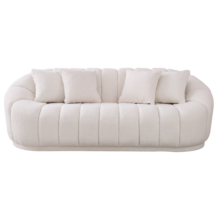 The Ashcroft Furniture Maximilian Japandi Channel Tufted Boucle Sofa 86” features plush off-white upholstery, rounded edges, vertical channel tufting, and four matching square throw pillows for modern sustainable luxury.
