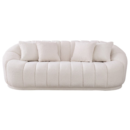 The Ashcroft Furniture Maximilian Japandi Channel Tufted Boucle Sofa 86” features plush off-white upholstery, rounded edges, vertical channel tufting, and four matching square throw pillows for modern sustainable luxury.