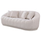 The Ashcroft Furniture Maximilian Japandi Channel Tufted Boucle Sofa 86” features a modern, plush white design with curved edges, vertical tufting, four matching cushions, and is shown against a plain white background.