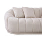 The Ashcroft Furniture Maximilian Japandi Channel Tufted Boucle Sofa 86” features plush cream boucle, a rounded back and armrest, vertical stitching, and two matching square pillows for a touch of sustainable luxury.