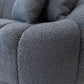 Close-up of the Ashcroft Furniture Maximilian Japandi Channel Tufted Boucle Sofa 86” in gray, highlighting its textured boucle fabric, soft plush padding, stitched seams, and channel tufting.