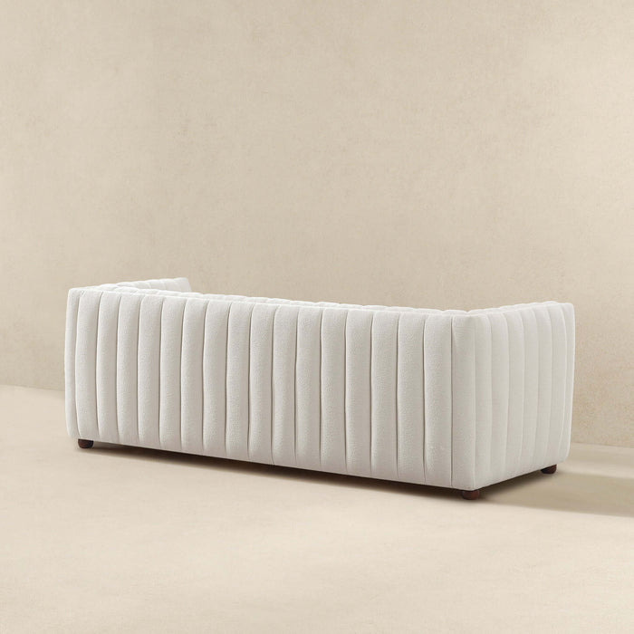 April Channel Tufted Boucle Sofa 86" – Beige Modern Glam Couch in textured boucle fabric and bold channel tufting.