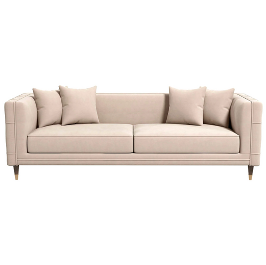 The Ashcroft Furniture Edward MCM Elegant Tufted Velvet Sofa 90 features square arms, wooden legs, four matching throw pillows, and subtle mid-century design elements, shown in beige against a white background.