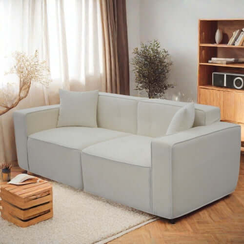 Modern low profile box arm memory foam sofa in light fabric, designed for ultimate comfort and style.
