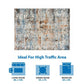 Abstract multi-color area rug ideal for high-traffic areas, suitable for living and dining rooms, available in two sizes.