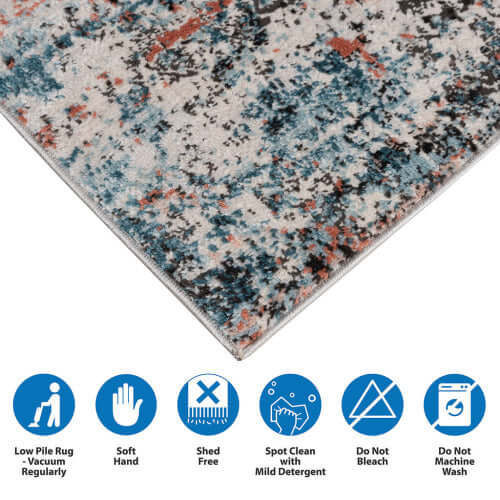 Close-up of Abstract Multi-Color Area Rug showing low pile, soft texture, care instructions and vibrant color pattern.
