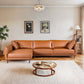 Cairo Cognac PU Leather Chaise Sofa Sectional 117" in a modern living room setting with decorative elements.