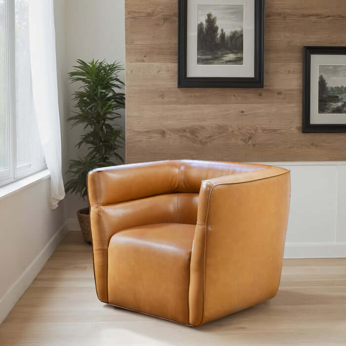 Callan Faux Tan Leather Swivel Chair in modern living space with wood accents and potted plant.