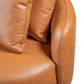 Close-up of the Dylan Modern Cognac Faux Leather Sofa showcasing its elegant curves and soft pillows.