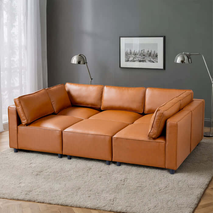 Reno Cognac PU Leather Modular Sofa Sectional in a stylish living room setting with modern decor.