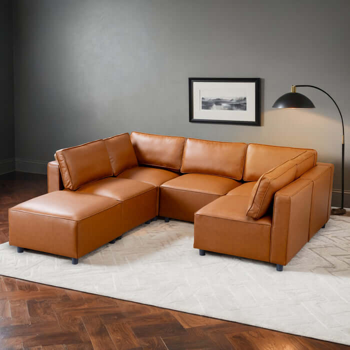 Reno Cognac PU Leather Modular Sofa Sectional in modern living room setup with warm tones and stylish design.