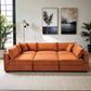 Uptown Burnt Orange Velvet Modular Sofa Sectional in modern living room with art and plants.
