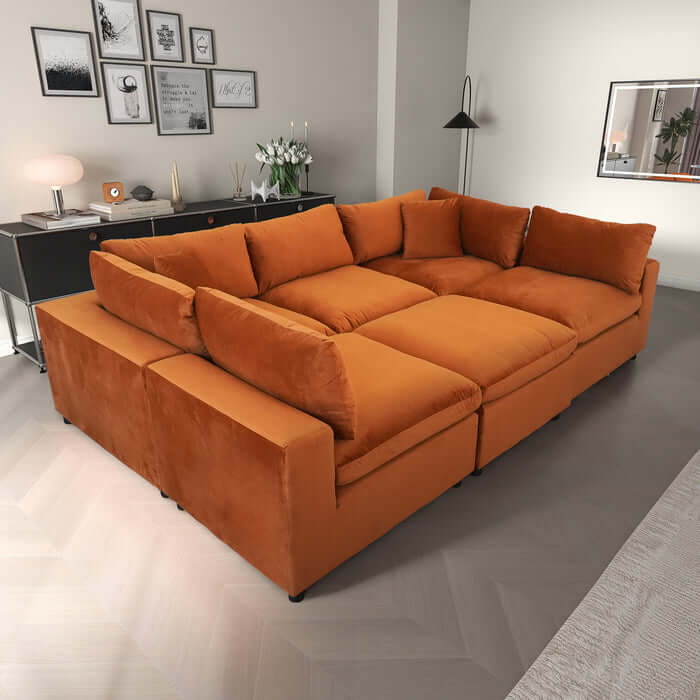 Hayward Velvet Modular Sectional Sofa in orange, featuring plush upholstery and customizable design for stylish comfort.