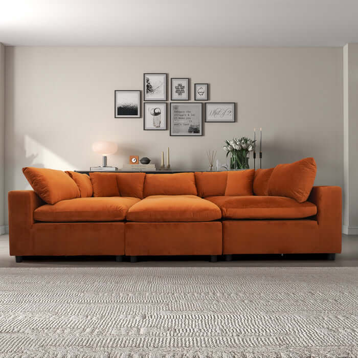 Hayward Velvet Modular Sectional Sofa in orange, featuring plush upholstery and customizable design for any living space.