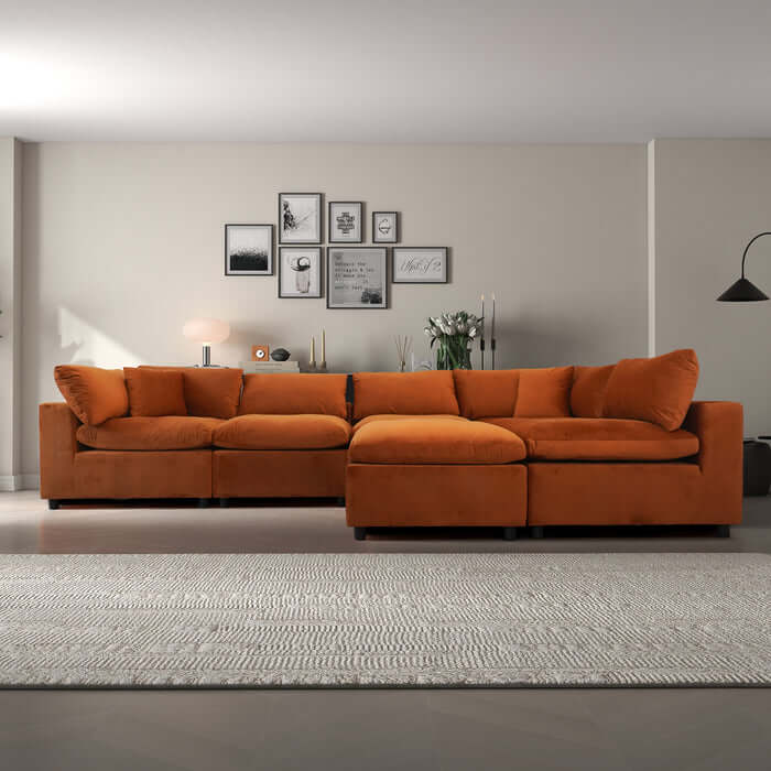 Hayward Velvet Modular Sectional Sofa in orange, featuring plush cushions and a modern design, ideal for stylish living spaces.