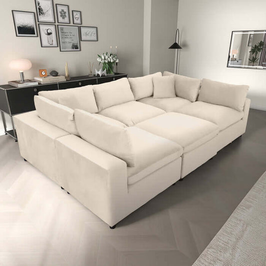 Hayward Velvet Modular Sectional Sofa in cream color, spacious, plush, and customizable for any living space.