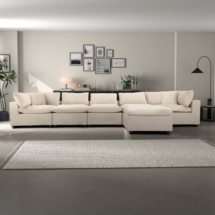 Hayward Velvet Modular Sectional Sofa in cream color, showcasing plush upholstery and a customizable design.