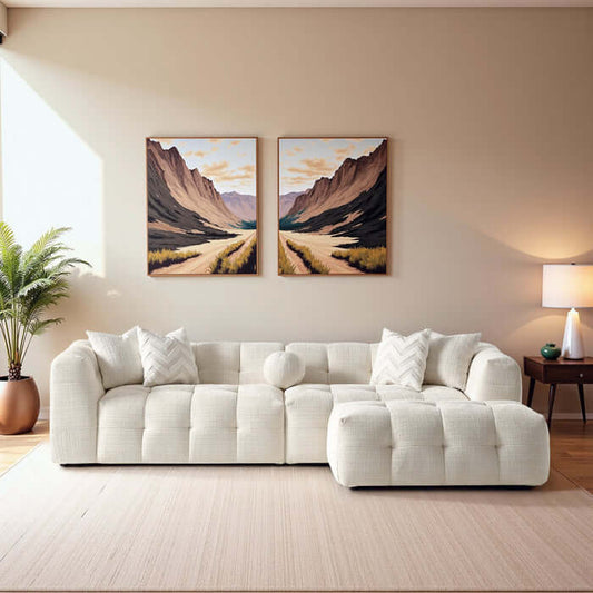 Alana tufted ivory chenille modular sofa with ottoman in a cozy living room setting.
