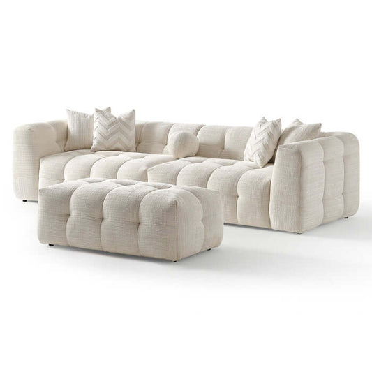 Alana Tufted Ivory Chenille Modular Sofa with Ottoman showcasing plush tufted design and cozy pillows.
