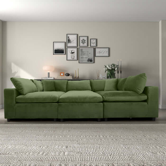 Hayward Velvet Modular Sectional Sofa in green, showcasing plush upholstery and customizable design in a modern living room setting.