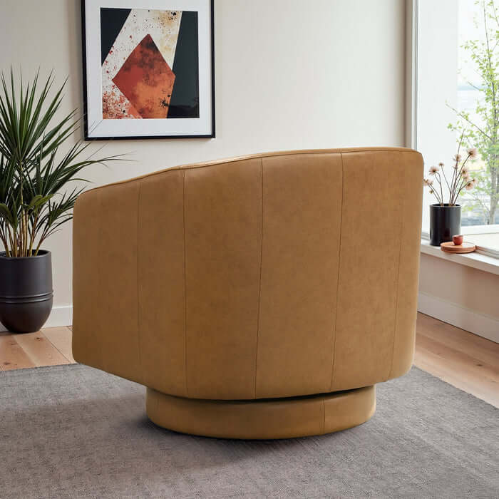 Danville Top-Grain Leather 360° Swivel Accent Chair shown in a stylish interior space, emphasizing comfort and design.
