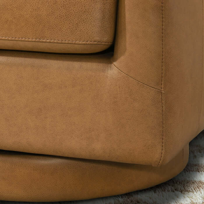 Danville Top-Grain Leather 360° Swivel Accent Chair close-up, showcasing the luxurious top-grain leather texture.