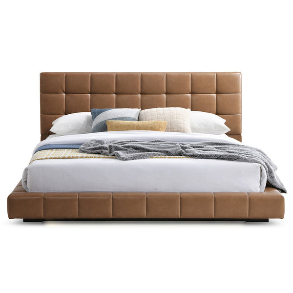 Hudson leather upholstered queen platform bed frame with biscuit-tufted headboard in tan.