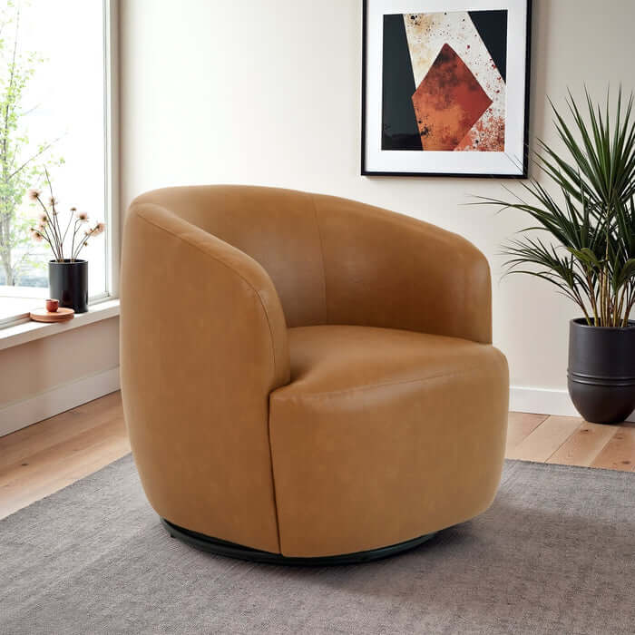Mina Tan Vegan Leather Swivel Barrel Chair in modern interior setting, showcasing sculptural design and comfort.