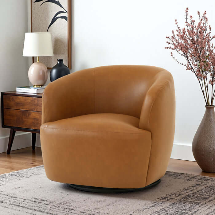 Mina Tan Vegan Leather Swivel Barrel Chair in modern living room setting with stylish decor.