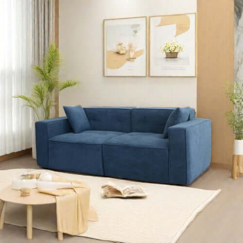 Modern low profile blue box arm memory foam sofa in a stylish living room setting.