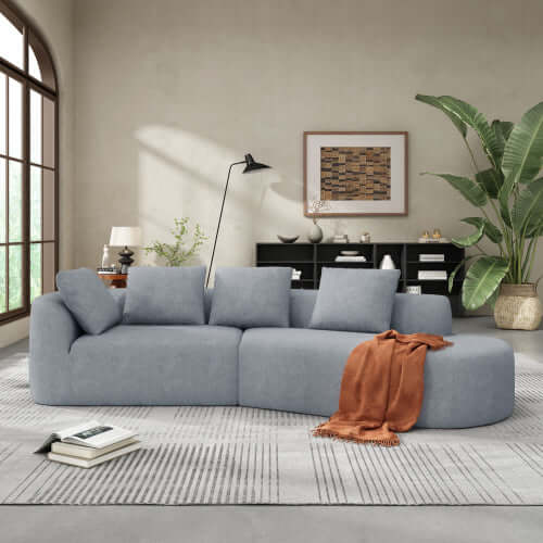Modern Low Profile Modular Curved Foam Sofa 116' (4 Colors) in a stylish living room setting with a cozy aesthetic.