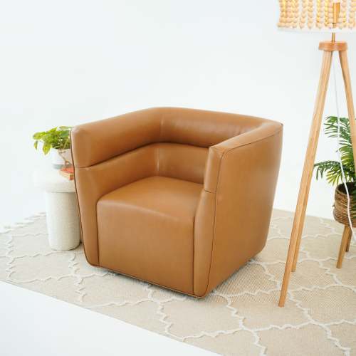 Tan Faux Leather Swivel Chair – Modern Barrel Accent Chair with 360° Swivel (Fully Assembled) in a stylish living space.