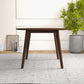 Lara MCM Solid Walnut Round Dining Table 43" – Modern Wood Dining Table in a warm, inviting setting with plants.