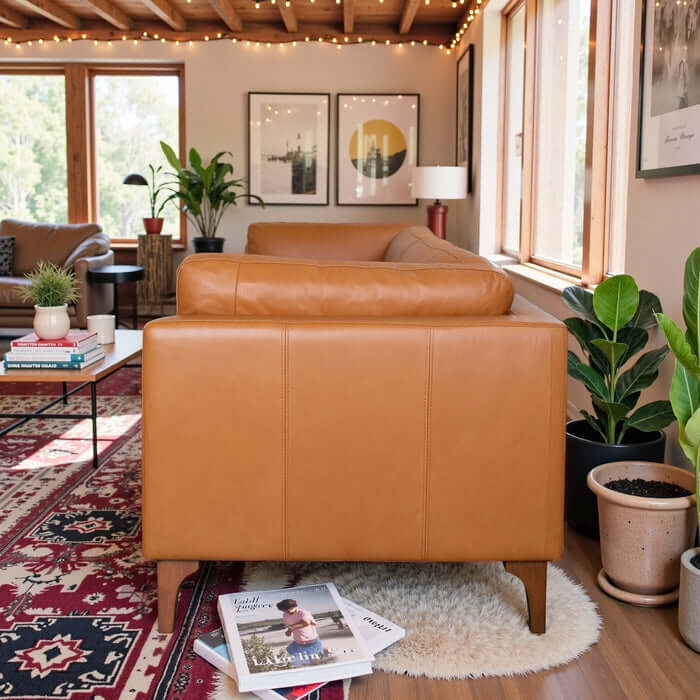 Bellrose MCM Genuine Leather Sofa 93W in a stylish living room with a tan finish and walnut legs.