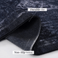 Close-up of black and gray area rug showing durable edge and non-slip backing features.