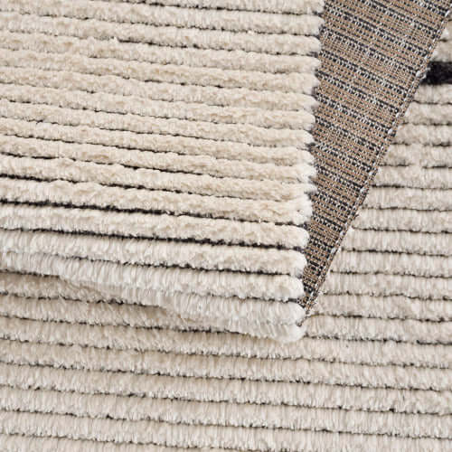 Close-up of the Black & Ivory Modern Diamond Design Area Rug showcasing its plush texture and layered look.