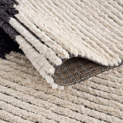 Close-up of the Black & Ivory Modern Diamond Design Area Rug showcasing its plush texture and quality craftsmanship.