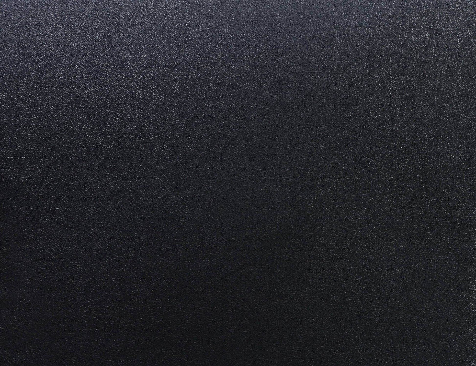 Close-up of black PU leather surface for the Pacari Black PU Leather Power 2D Massage Chair.