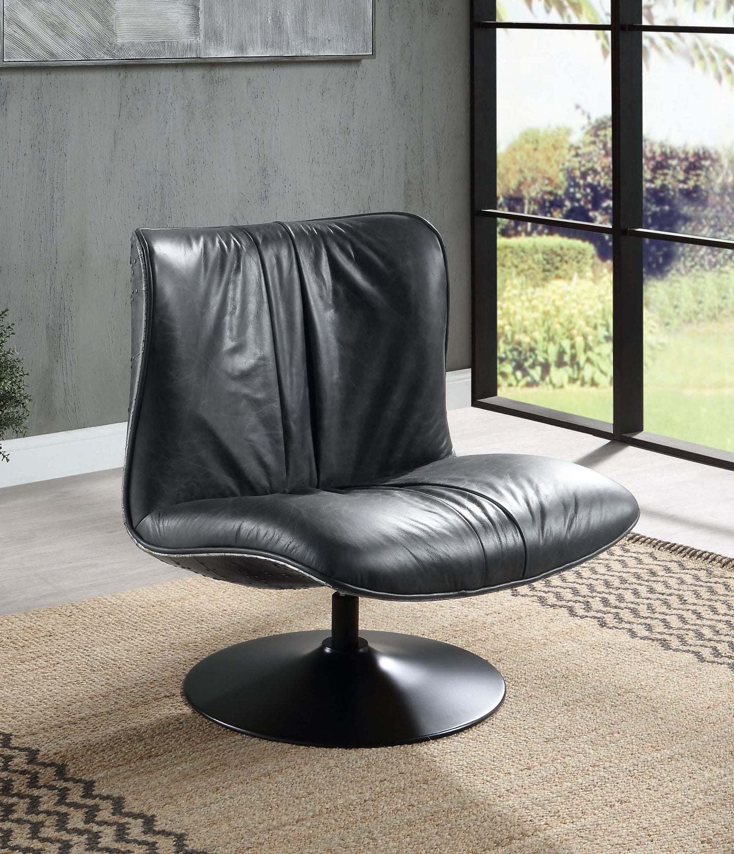 Piotr Black Top-Grain Leather Armless Accent Swivel Chair in modern living room setting.