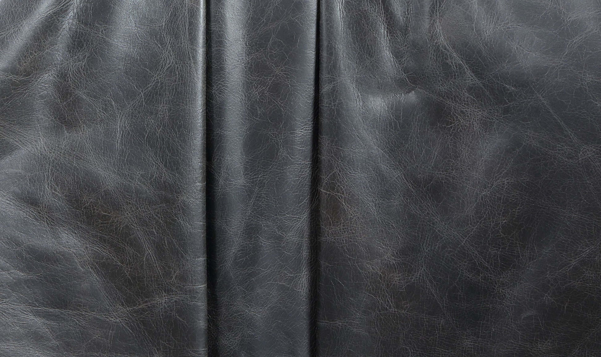 Close-up of Piotr Black Top-Grain Leather, showcasing premium texture and quality craftsmanship.