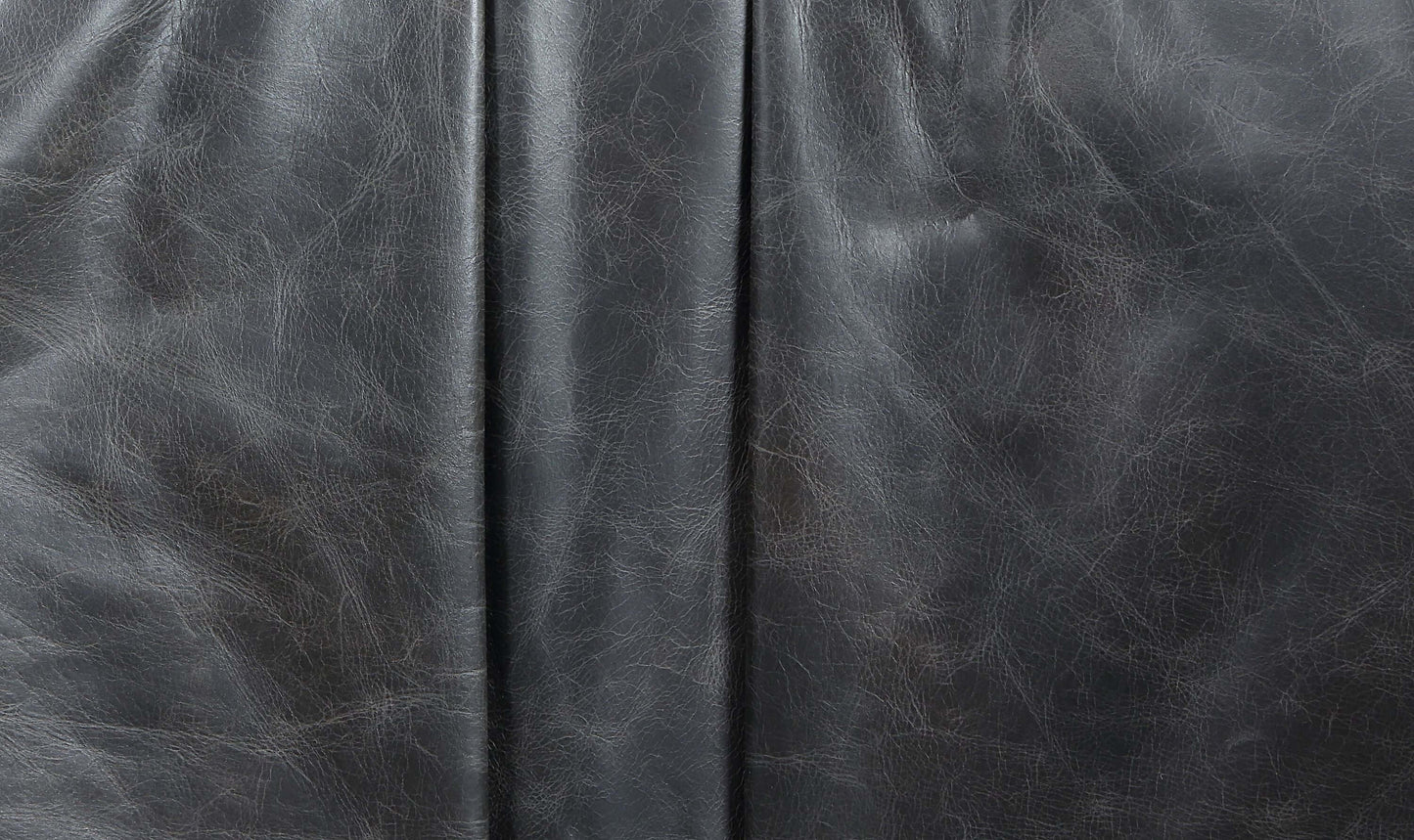 Close-up of Piotr Black Top-Grain Leather, showcasing premium texture and quality craftsmanship.