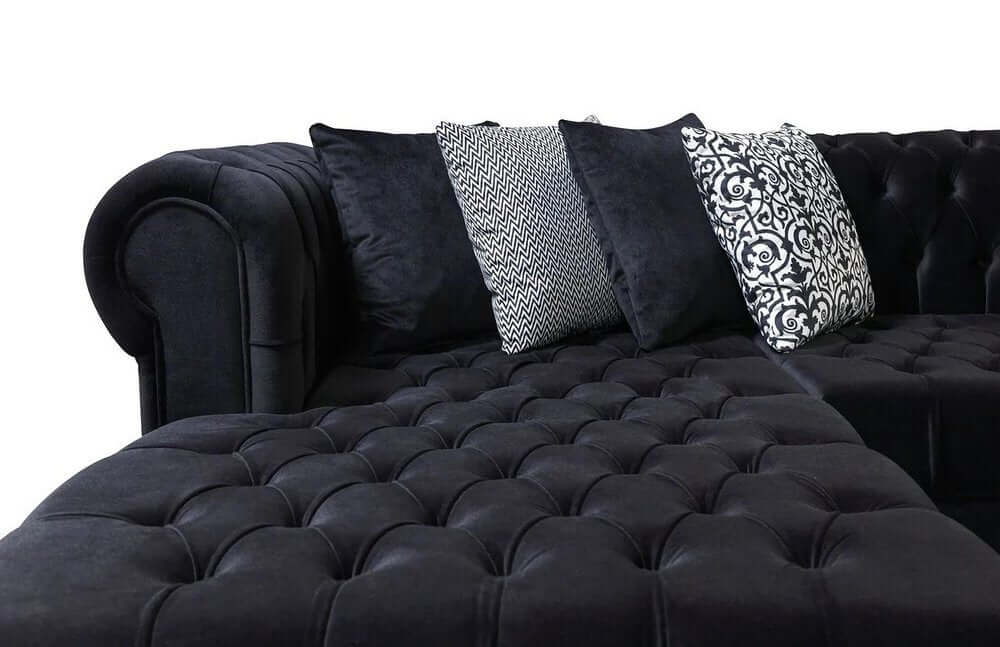 Black Velvet U Shaped Three Piece Sofa and Chaise Sectional With Toss Pillows close-up view showing tufted design and decorative cushions.