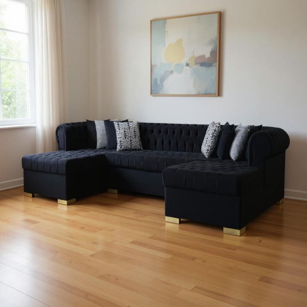 Black Velvet U Shaped Three Piece Sofa and Chaise Sectional With Toss Pillows in a stylish living room setting.