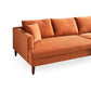 The Ashcroft Furniture Blake Velvet Upholstered L-Shape Chaise Sofa Sectional 107 features plush velvet upholstery, three large back cushions, wooden legs, and a matching throw pillow, shown against a white background.
