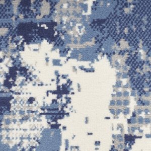 Blue abstract power-loomed runner rug featuring a modern pattern in shades of blue and cream.